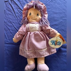 Vintage rag doll  tags attached , yarn hair 1980’s